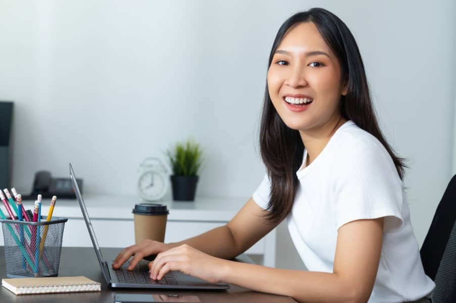 happy women with laptop